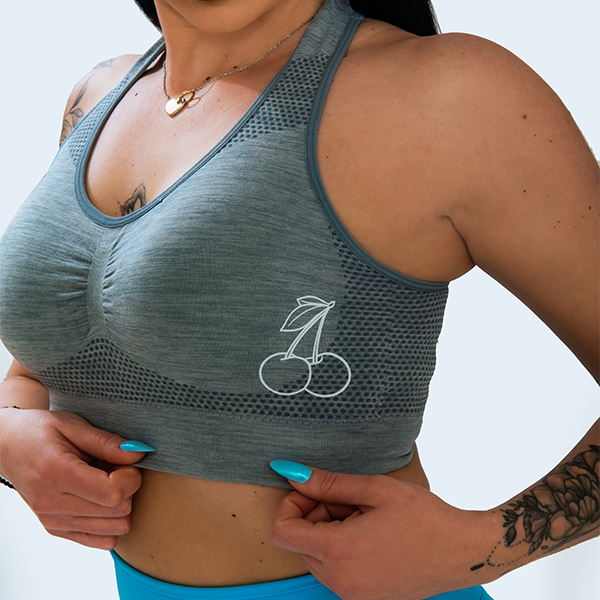 Grey sports bra with removable pads and holes - Image 3